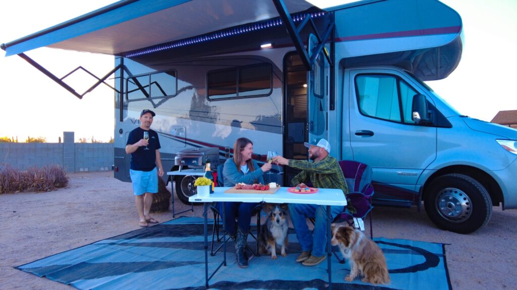 Family enjoying cute class C RV 