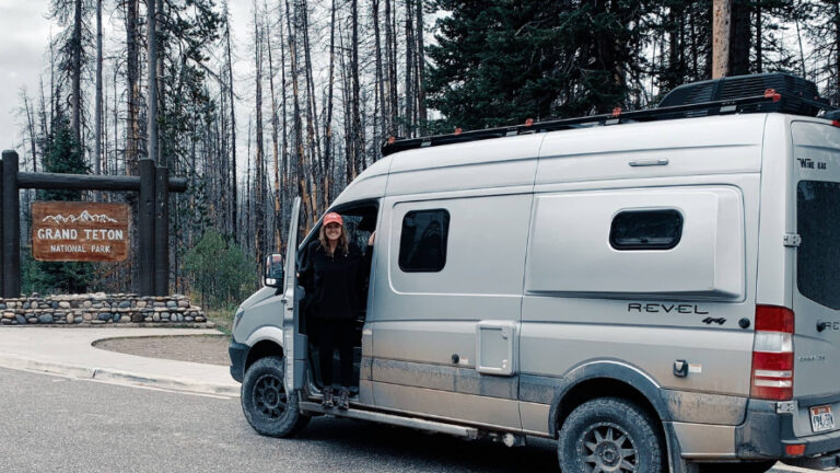 van at grand tetons national park with woman standing outside the door