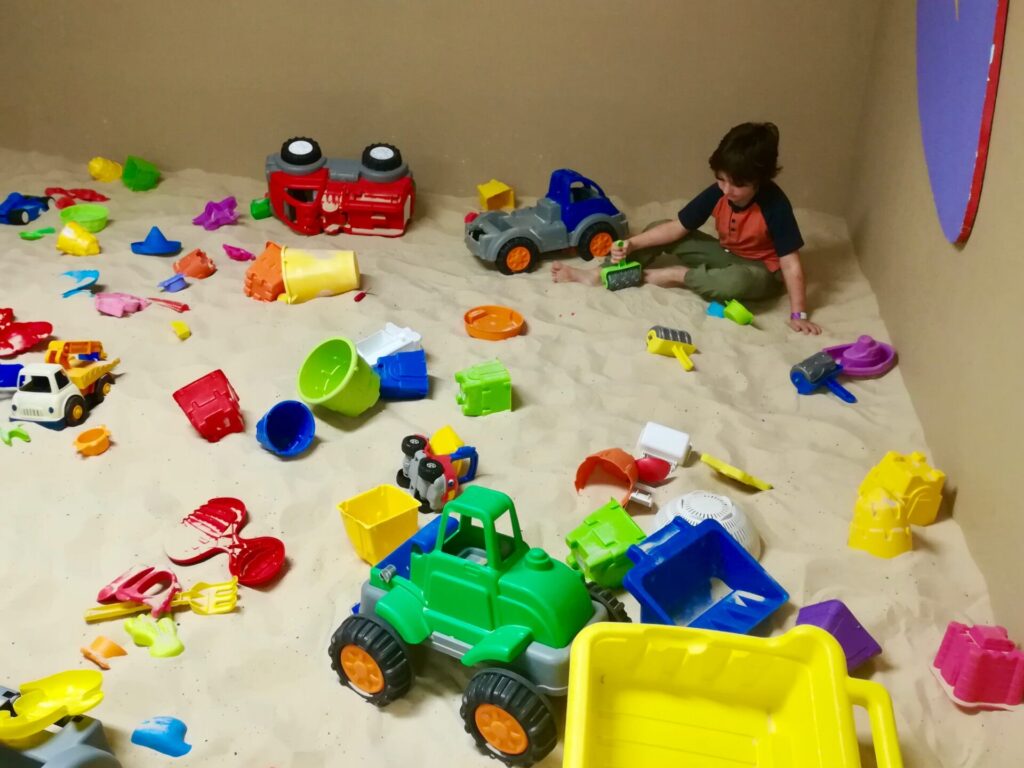 Boy playing in sand at Texas Children’s Museum 