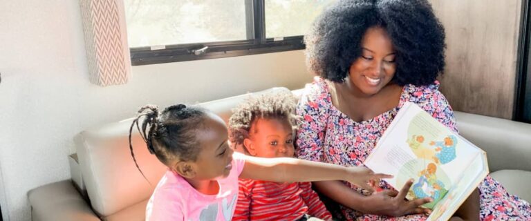 A mom reading to her kids in an RV