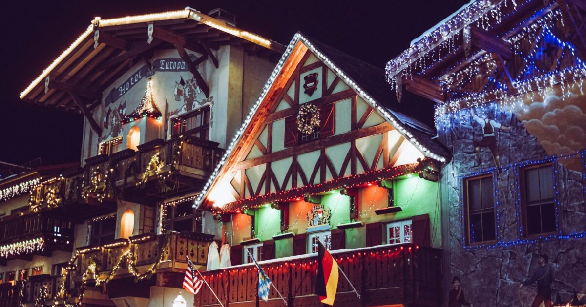 Bavarian-style buildings decorated with Christmas lights in Leavenworth, Washington.