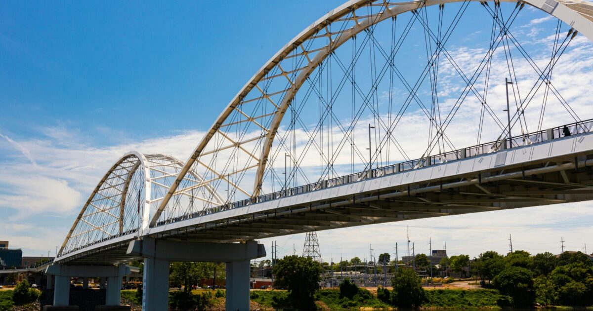 A bridge stretches over the Arkansas River to Little Rock, AR.