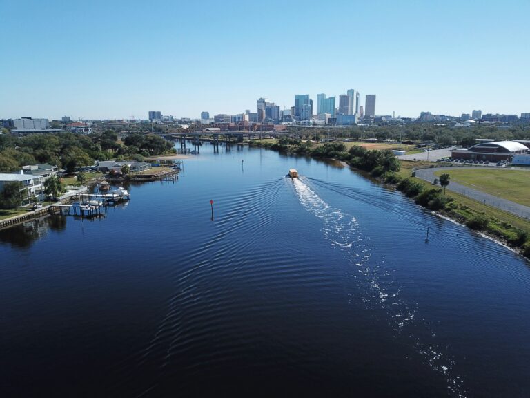 A white boat on water near the city of Tampa, FL