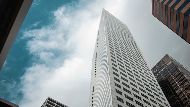 Tall buildings against cloudy skies in Houston, TX
