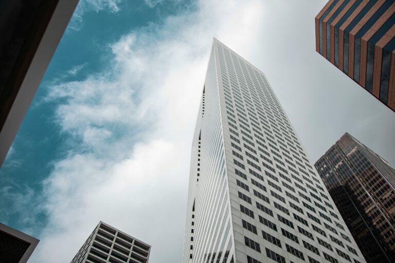 Tall buildings against cloudy skies in Houston, TX