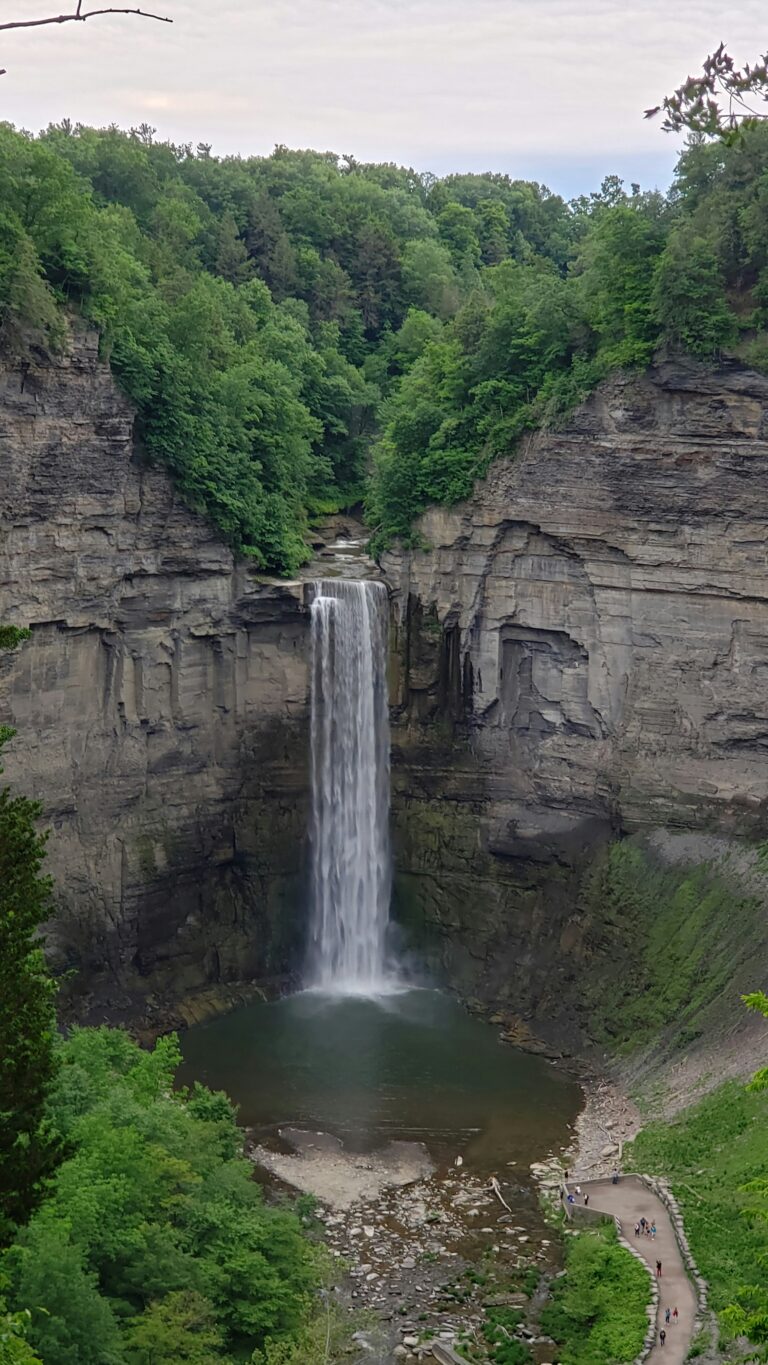 Rock cliff with a waterfall pouring down in Finger Lakes, NY