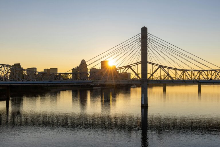 A bridge over water at sunset in Louisville, KY