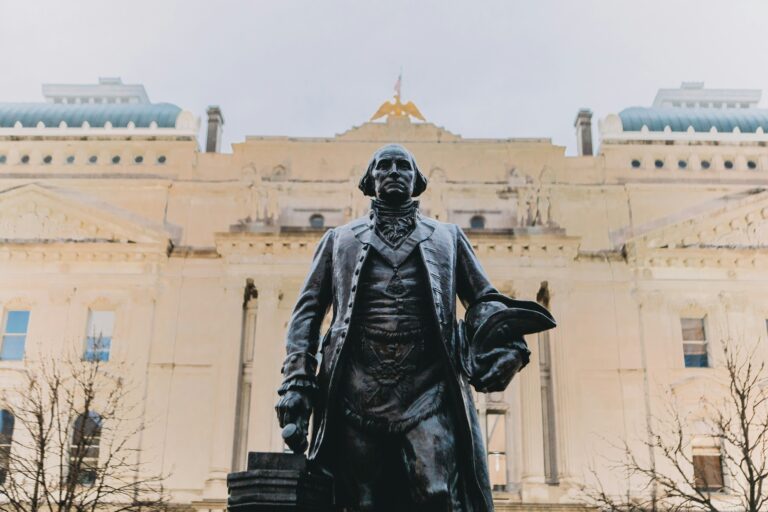 Statue of a man in front of the Indiana State House