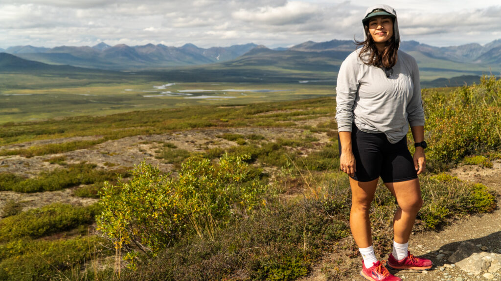 woman in front of view from denali highway