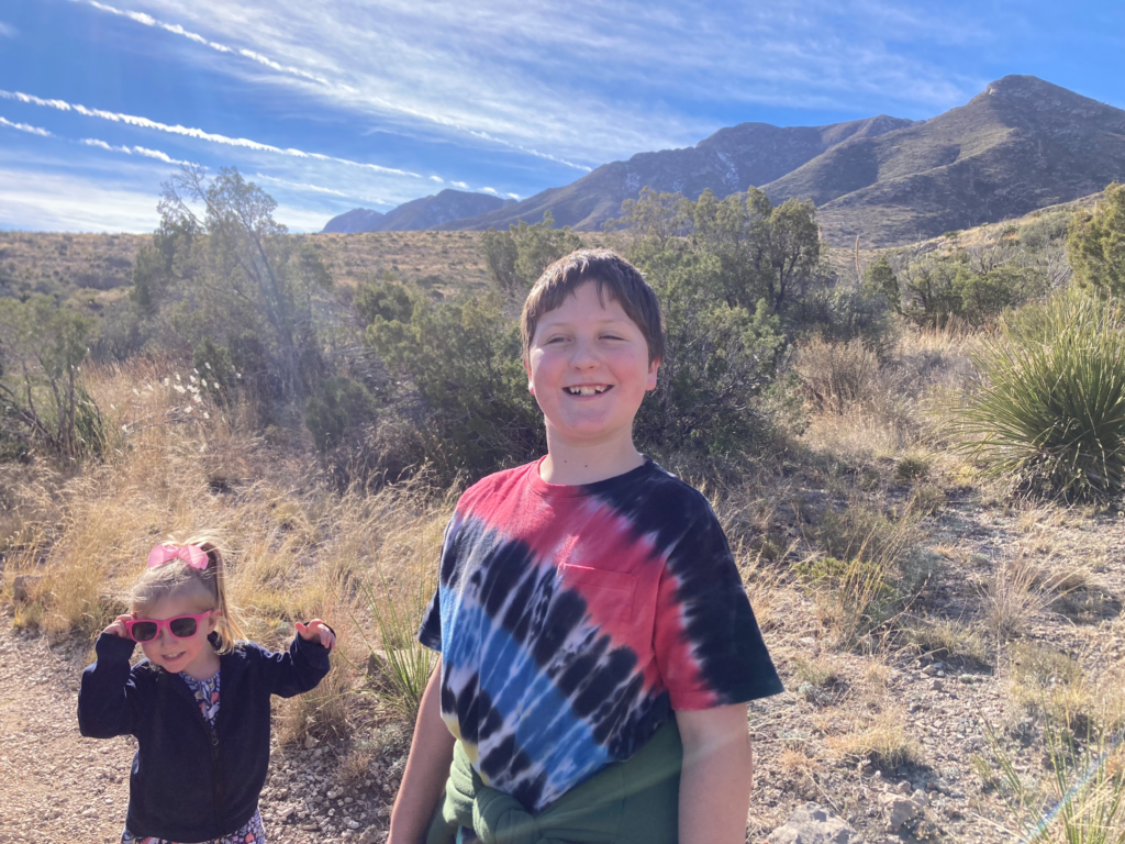 Brother and sister hiking in Guadalupe Mountains National Park, one of the best destinations in Texas