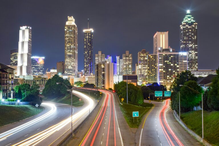 A time-lapse photo of Atlanta, Georgia showing skyscrapers lit up at night.