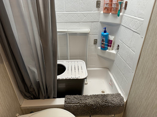 Top entry cat litter box inside camper shower 