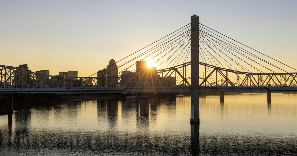 Sunset over water in Louisville, one of the best places for Kentucky urban camping