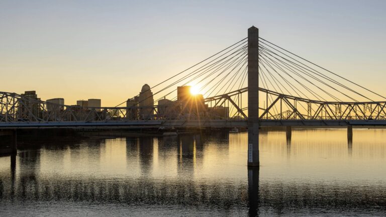 Sunset over water in Louisville, one of the best places for Kentucky urban camping