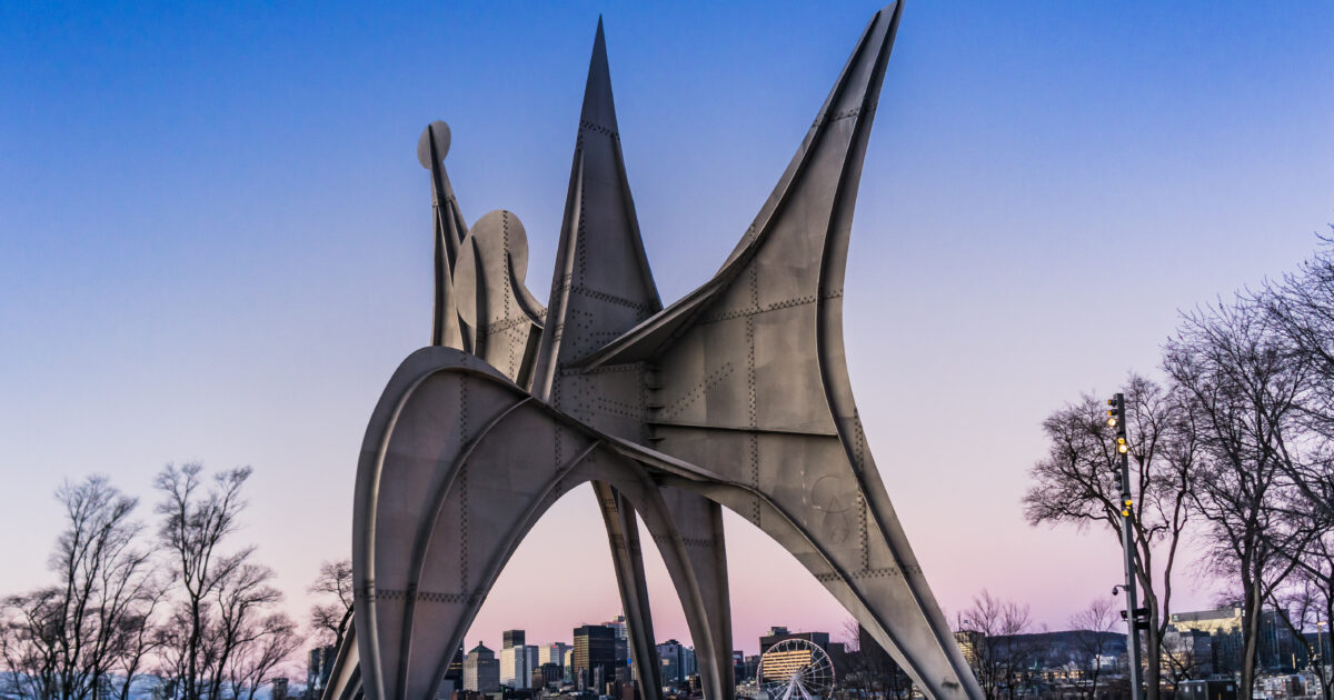 View at sunrise on the Tree Disks, also called "The Man", a gigantic steel sculpture of Alexander Calder, in Jean Drapeau park in Montreal, Canada