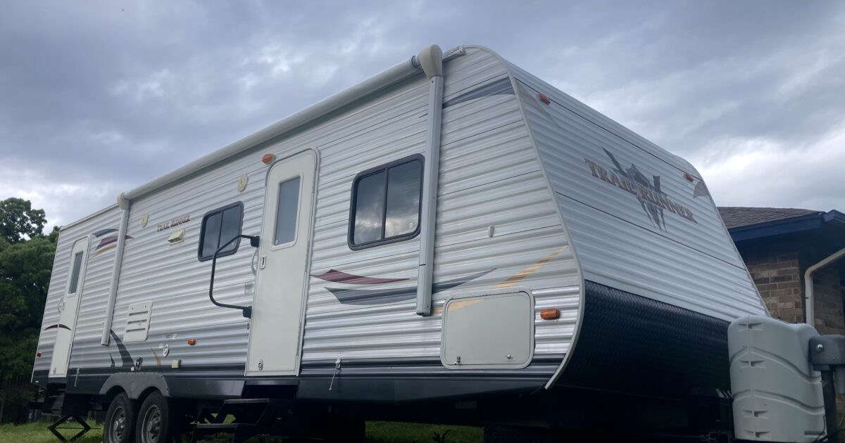 Our RV with a storm looming overhead while RVing during tornado season