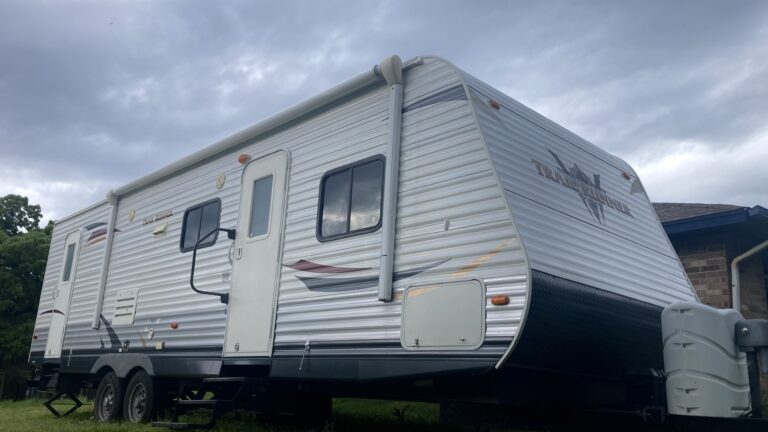 Our RV with a storm looming overhead while RVing during tornado season