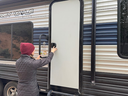 woman using RVLock in a travel trailer