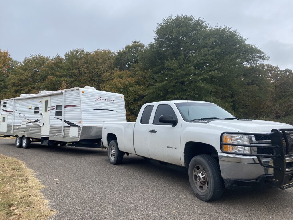 Our second travel trailer hitched up to our truck.