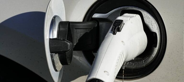 an EV charging at a charging station. EV RV travel begins with a proper charge