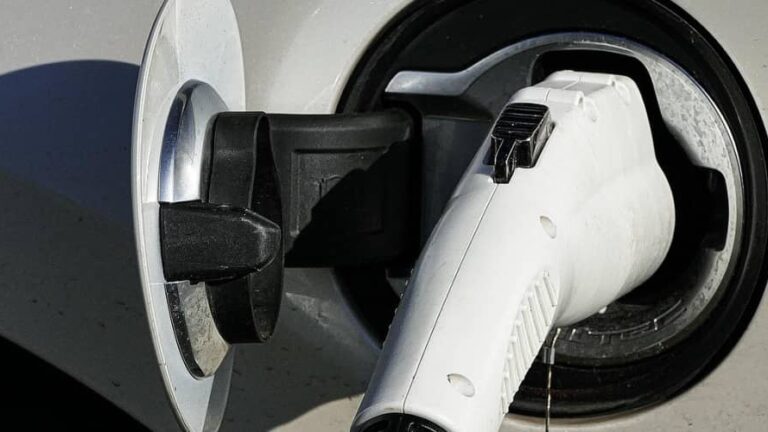 an EV charging at a charging station. EV RV travel begins with a proper charge