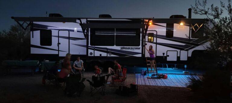 RVing with teens relxing in chairs with the RV in the background