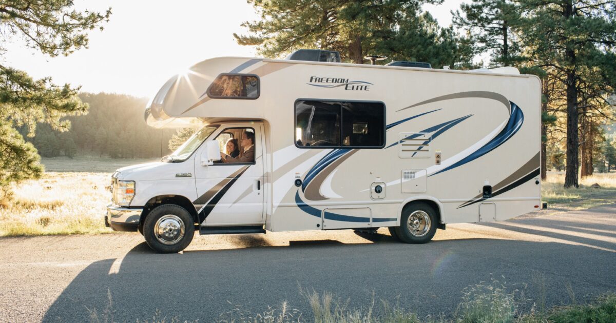 People driving motorhome bought on RV consignment