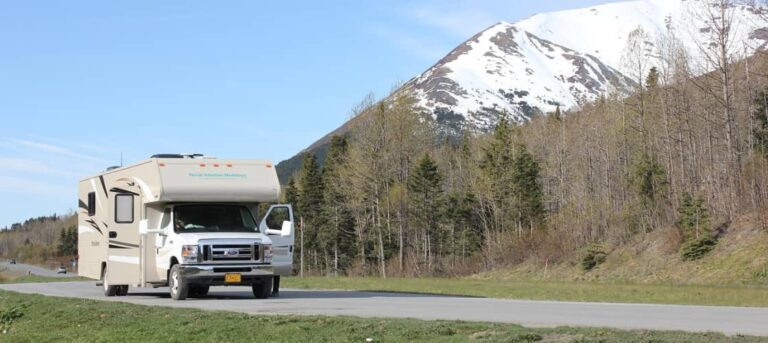 An RV driving down the road in Alaska