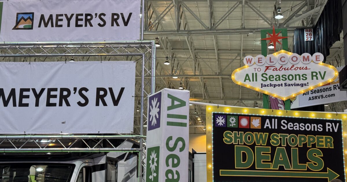 Signage advertising deals at an indoor RV show