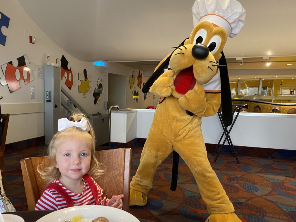 Our daughter enjoying a Christmas Eve character meal at Disney World