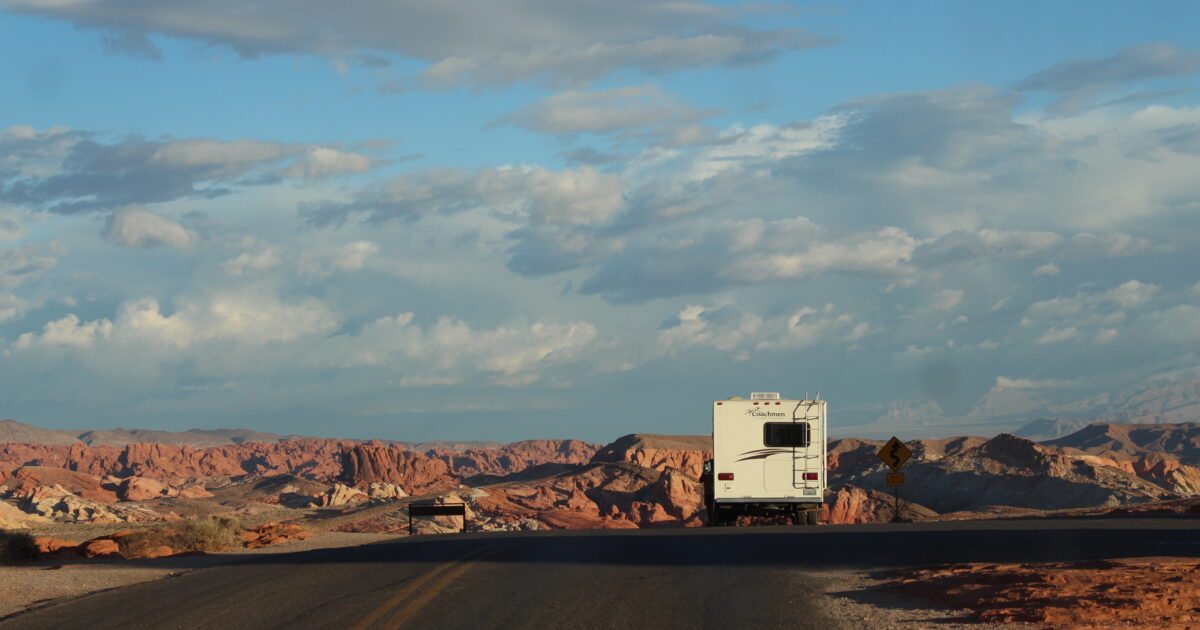 An RV driving down us route 50 as part of the road trip of the year itinerary