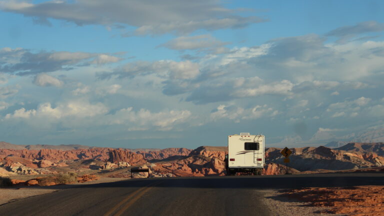 An RV driving down us route 50 as part of the road trip of the year itinerary