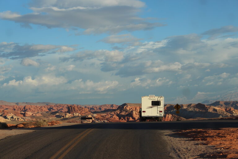 An RV driving down us route 50 as part of the road trip of the year itinerary