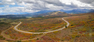 Aerial panoramic view of CO-62 scenic byway at Continental divide in Colorado during autumn time.