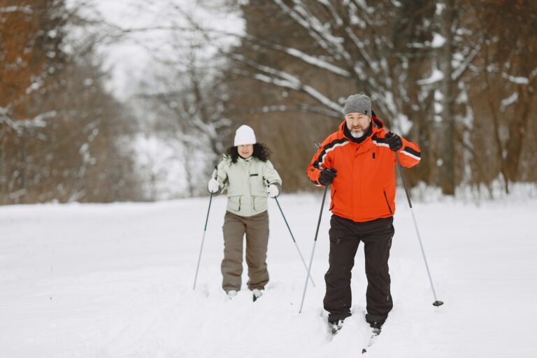 A happy couple cross-country skis in one of America's national parks