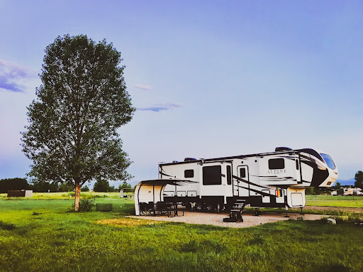 fifth wheel RV set up with essentials for off grid camping