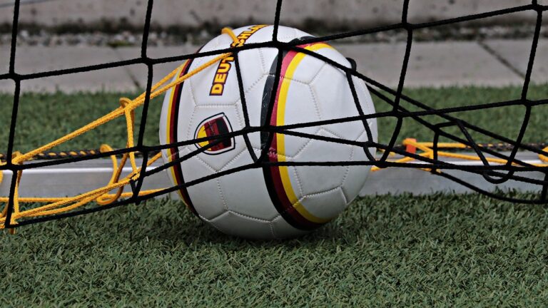 A soccer ball trapped in a net