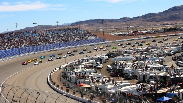 RVs clustered in a campground at the center of a NASCAR race track